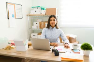 Entrepreneur sitting at a desk with a laptop, representing the success of Darren and Mike's online business strategies in digital entrepreneurship.