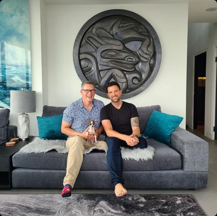Darren and Mike sitting on a sofa